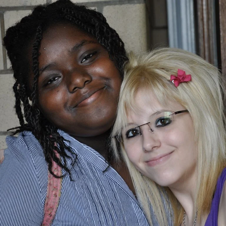 Two students smiling together for a photo
